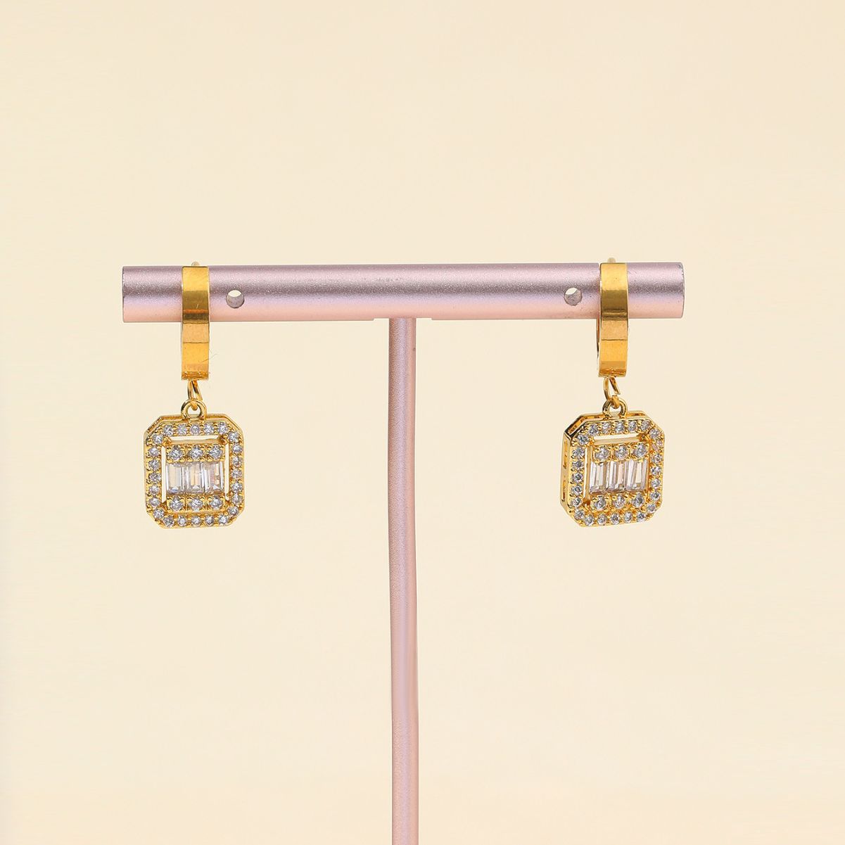 Gold huggie earrings with cubic zirconia