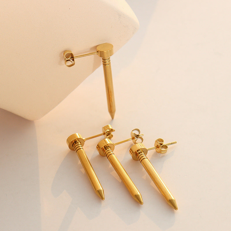 Gold spike stud earrings display