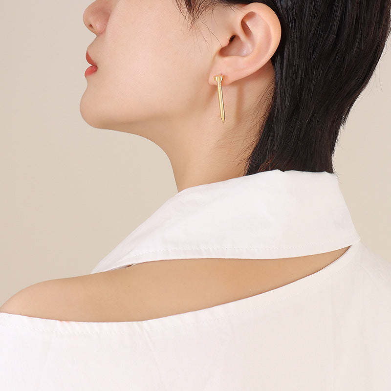 Gold spike stud earrings display